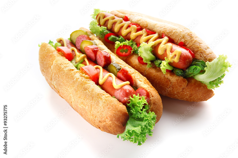 A pair of fresh hot dogs isolated on white A pair of fresh hot dogs isolated on white