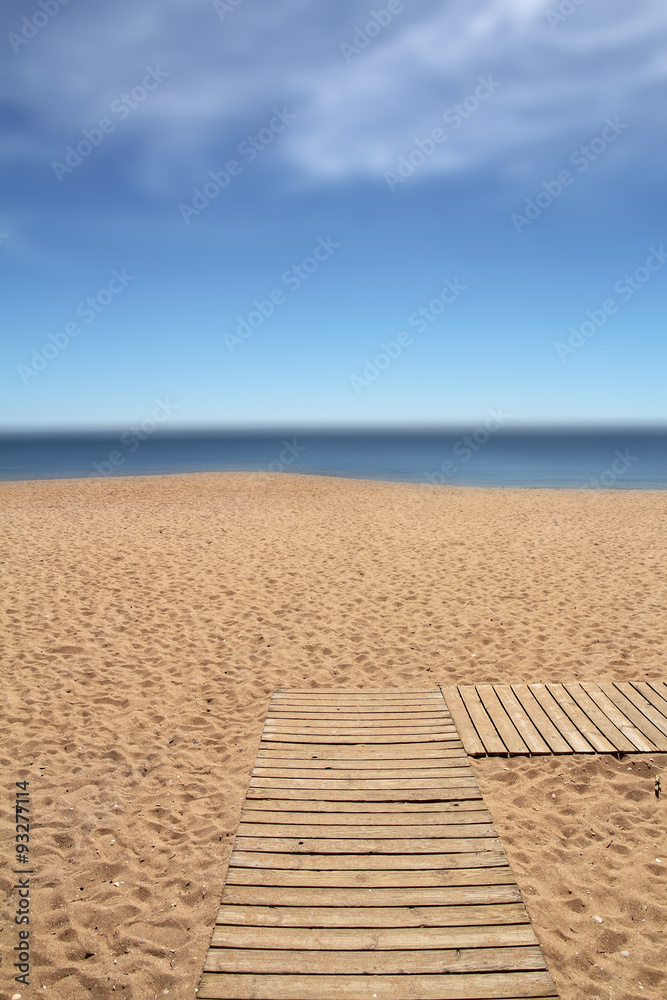 wooden pathway on the beach (blurred second plan- useful as a ba - obrazy, fototapety, plakaty 