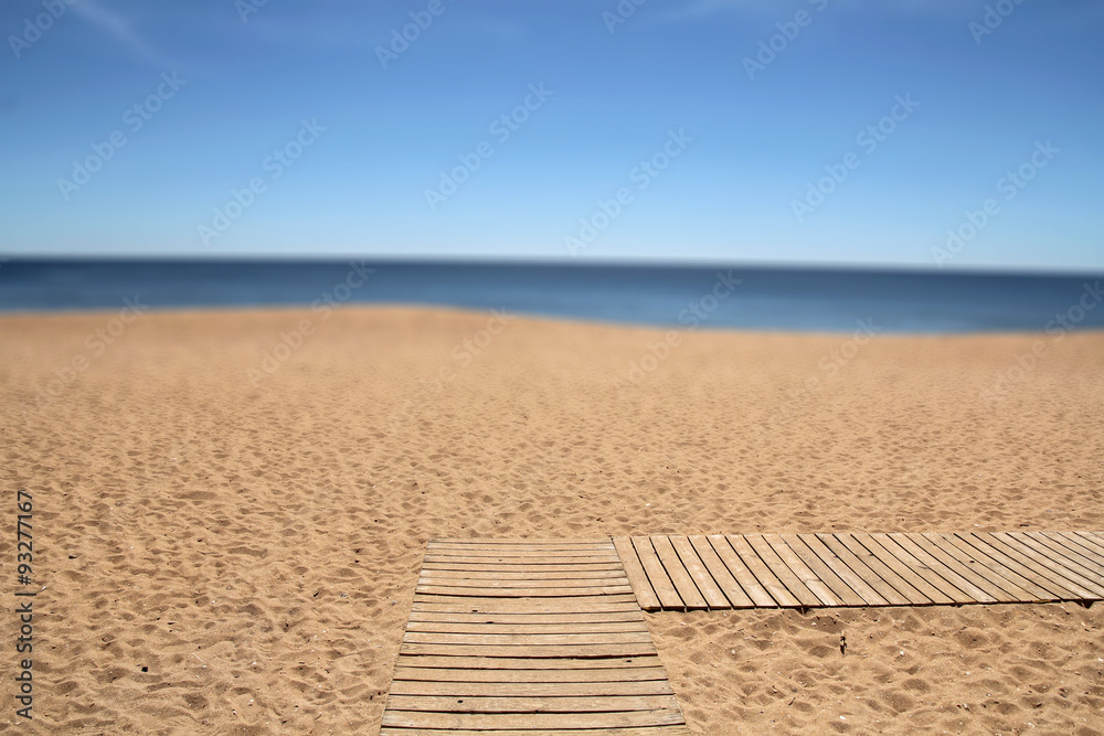 wooden pathway on the beach (blurred second plan- useful as a ba - obrazy, fototapety, plakaty 