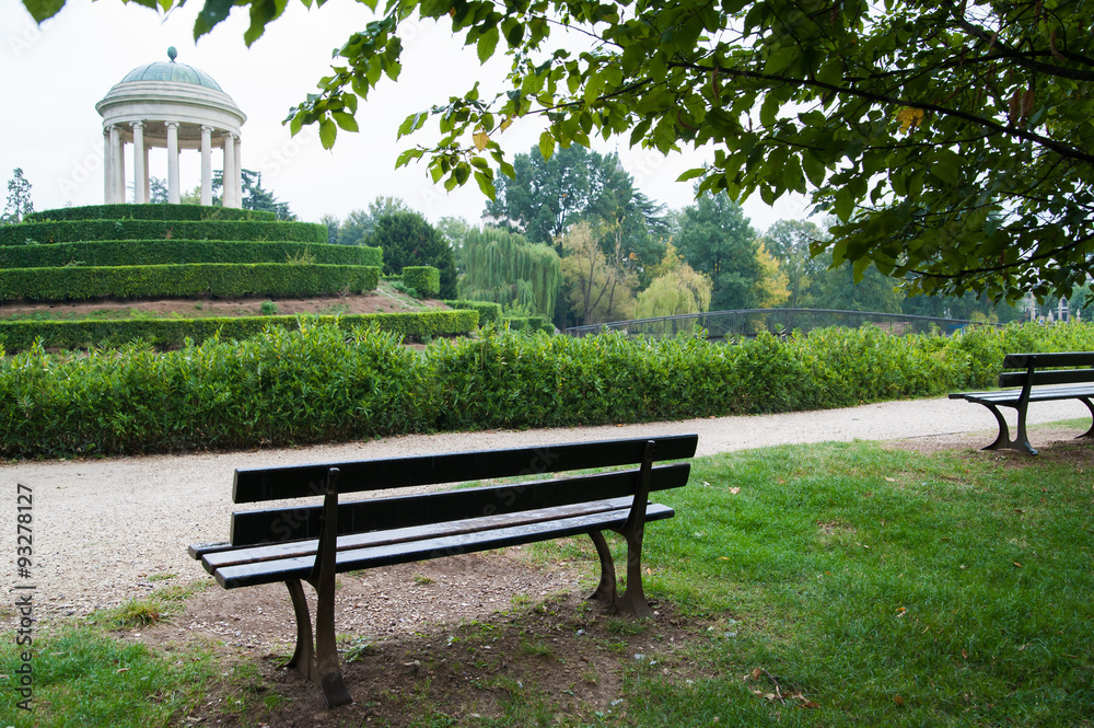 Wooden bench in Querini Park, Vicenza, with a view of the little temple Wooden bench in Querini Park, Vicenza, with a view of the little temple