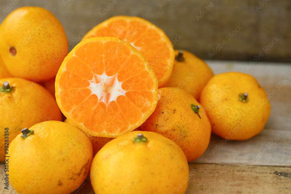 Fresh orange on wooden table in dining room. Healthy fruit for lose weight ,Fresh oranges on wooden background. Fresh orange on wooden table in dining room. Healthy fruit for lose weight ,Fresh oranges on wooden background.