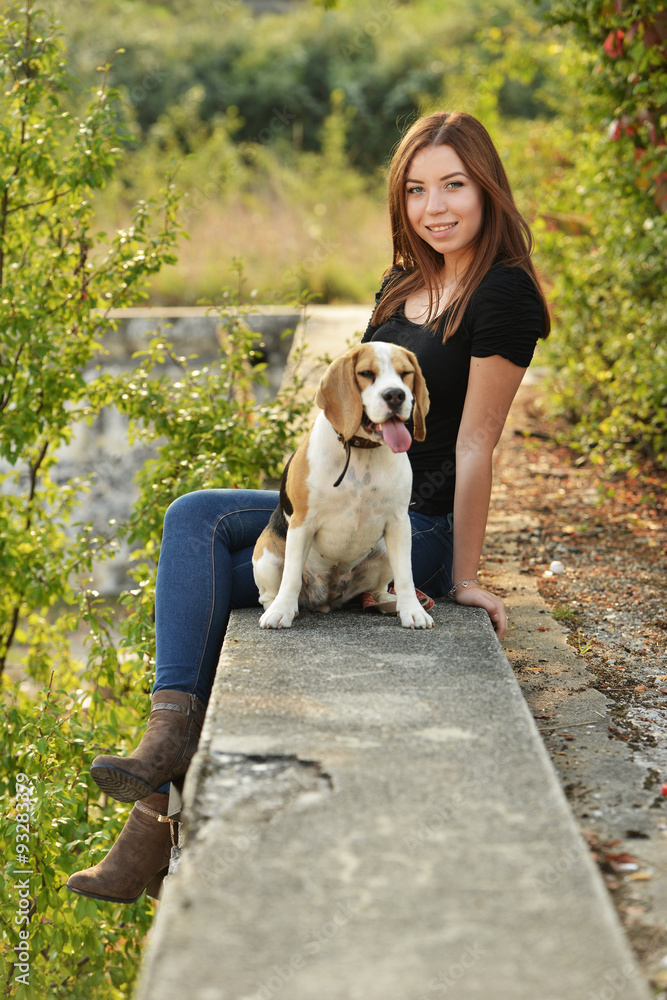 beautiful woman and his dog posing outside beautiful woman and his dog posing outside