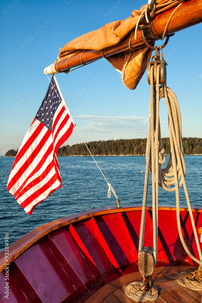 Fototapeta premium American flag waving from a sailboat 