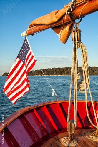 American flag waving from a sailboat 