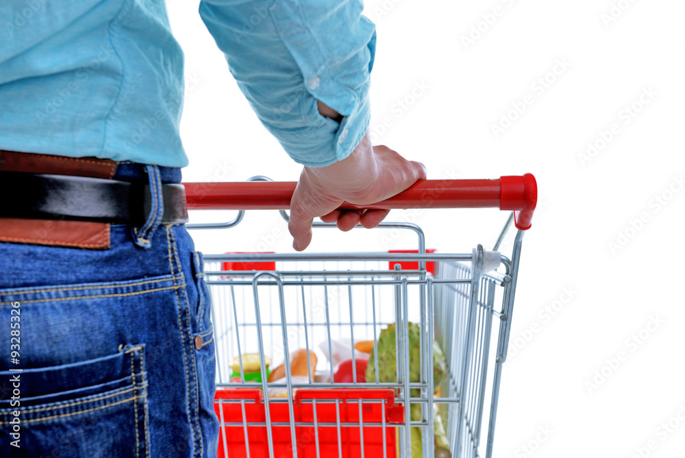 Young man with shopping cart isolated on white