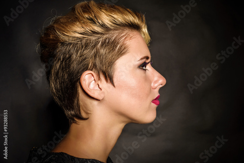 Wallpaper Mural Blonde with short hair on a dark background Torontodigital.ca
