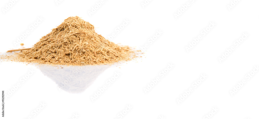 Dried lemongrass powder over white background Dried lemongrass powder over white background