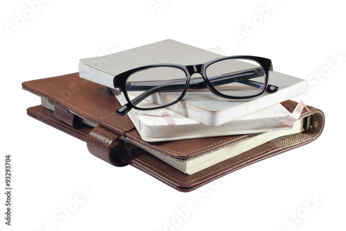 glasses on with books isolated on the white