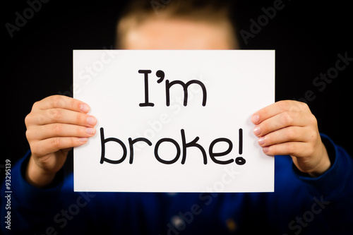 Person holding I am broke sign