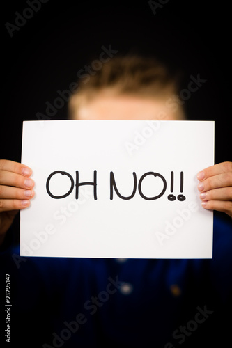 Child holding Oh No sign