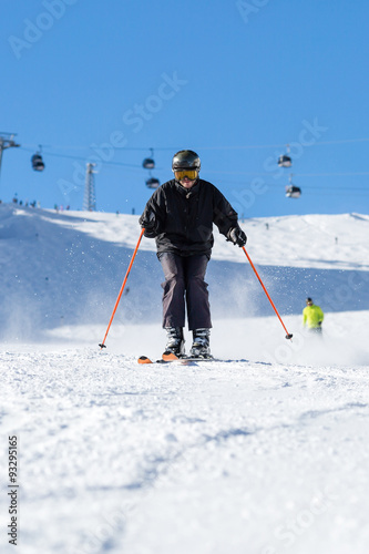 Skier skiing on ski slope