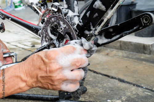 Hands of mechanic fixing a bicycle
