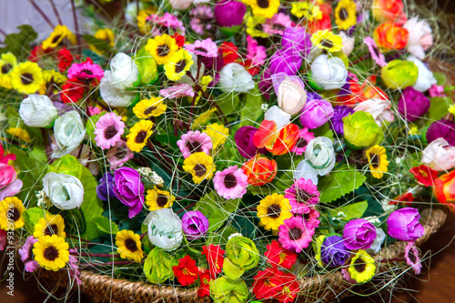 Fototapeta Naklejka Na Ścianę i Meble -   background colorful multicolored small artificial flowers in a