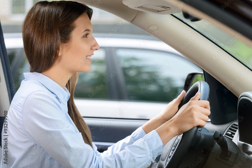 Pleasant girl driving a car Pleasant girl driving a car