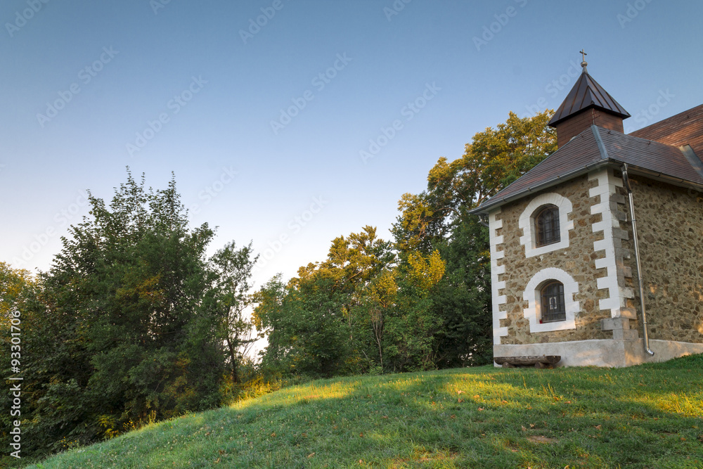 Naklejka premium Beautiful small church in the woods 
