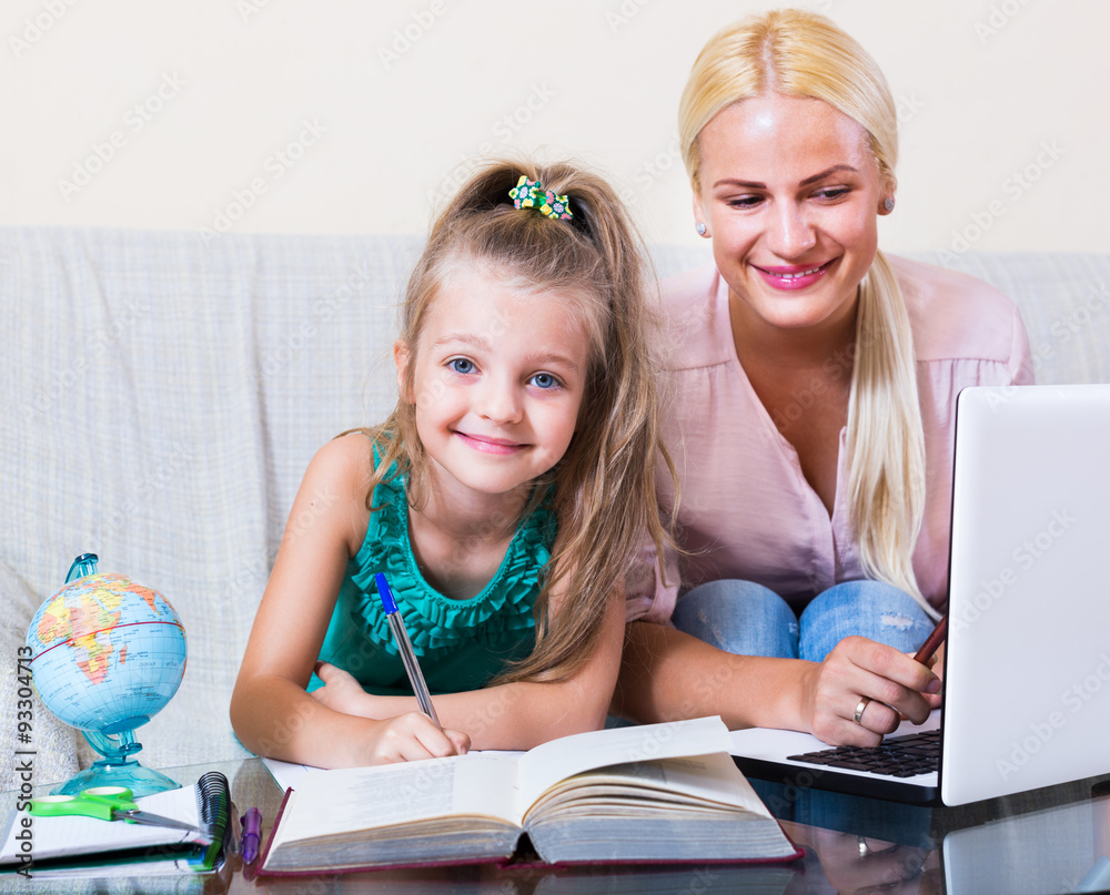 Fototapeta premium Woman and child having lesson