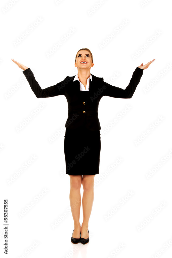 Businesswoman trying to catch something