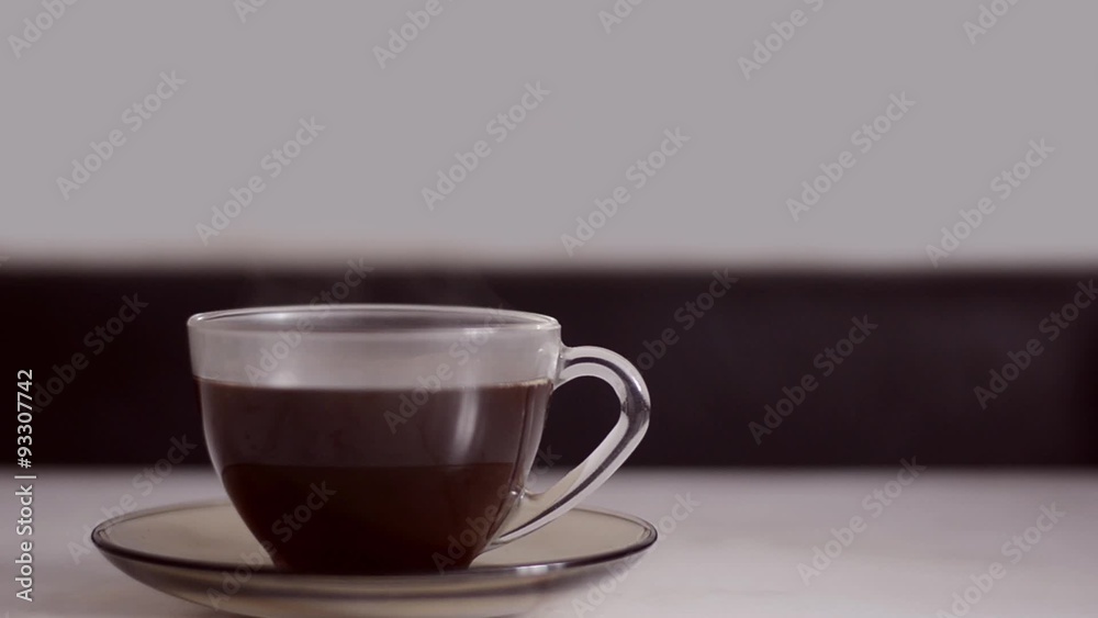 Hot coffee with steam in transparent mug Hot coffee with steam in transparent mug