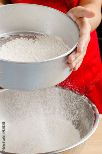 Sifting flour into the bowl,food ingredient,prepare for cooking or baking