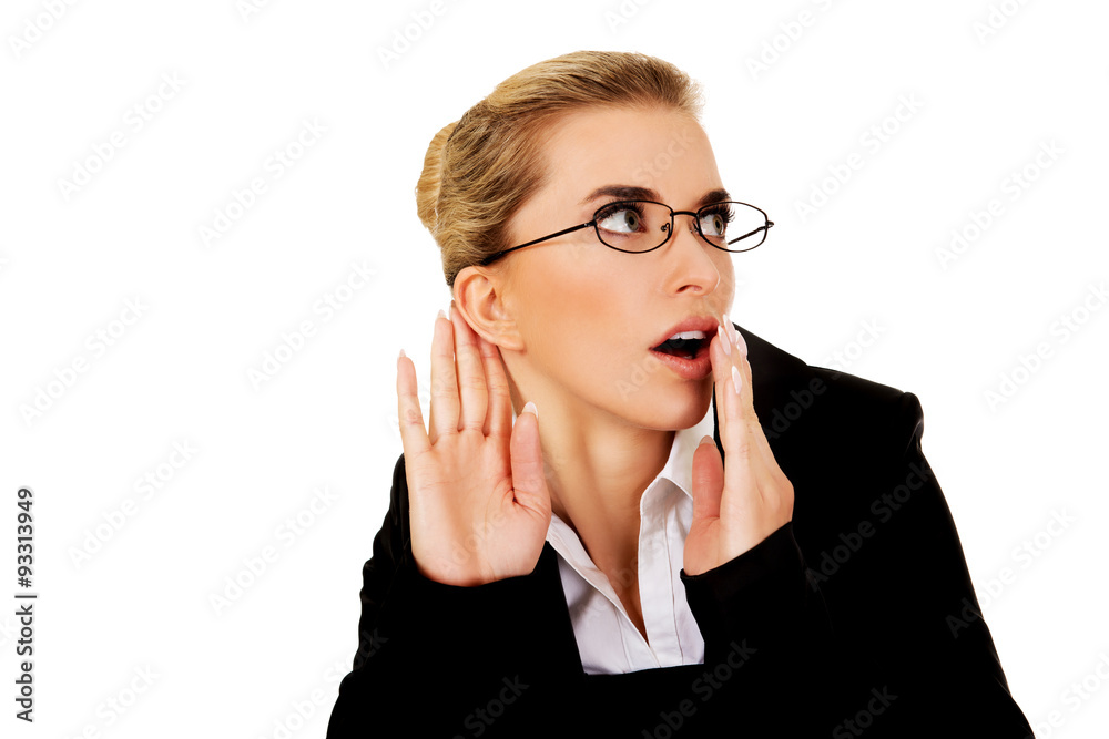 Beautiful businesswoman overhears a conversation Beautiful businesswoman overhears a conversation