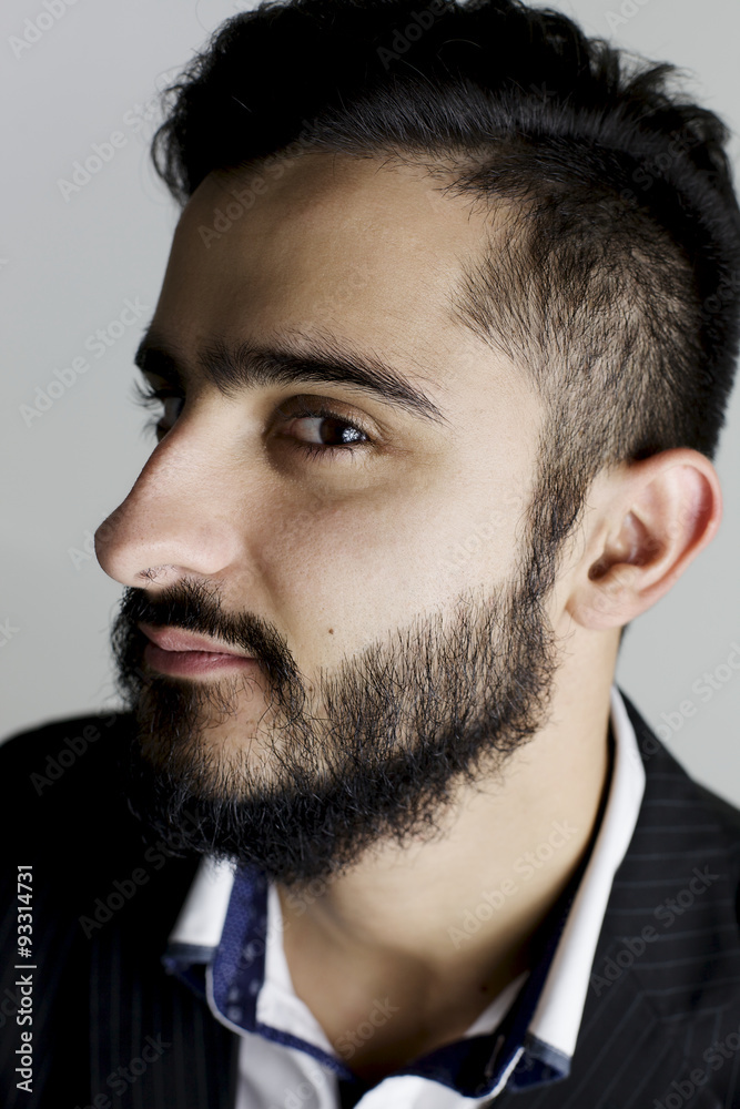 Obraz premium serious stylish hipster man locking at camera