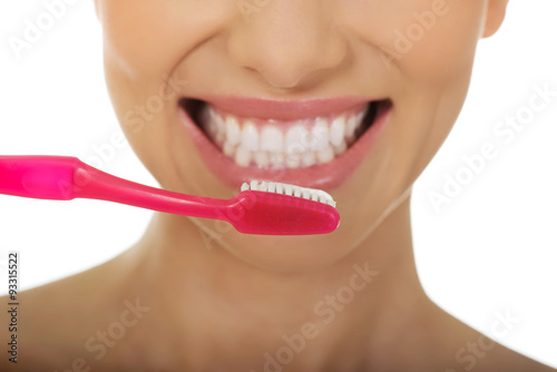 Beautiful woman with toothbrush.