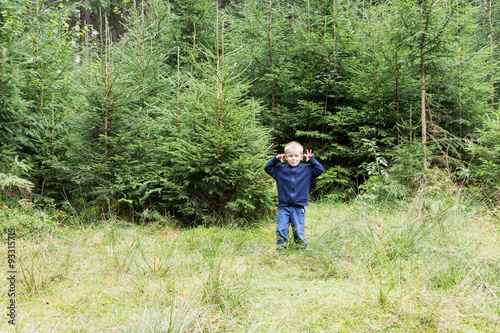 Portrait of a boy in the woods