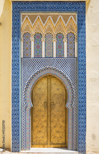 Magnificent oriental golden door with beautiful ceramic and tile work in Morocco.