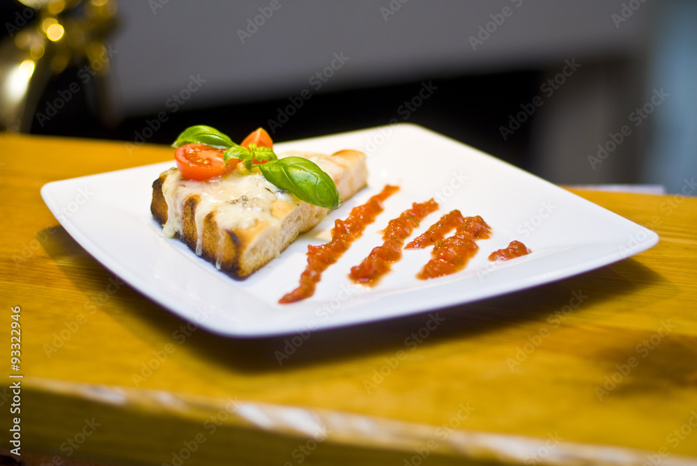 Bruschetta with mozzarella and tomato sauce