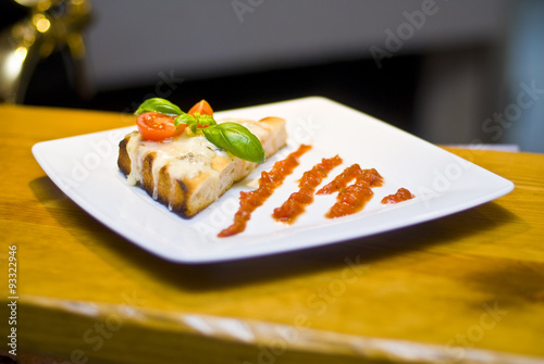 Obraz na płótnie Bruschetta with mozzarella and tomato sauce w salonie