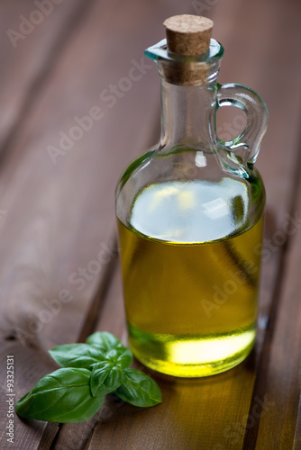 Bottle of extra virgin olive oil, closeup, selective focus