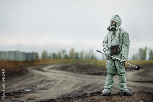 Scientist (radiation supervisor) in protective clothing and gas