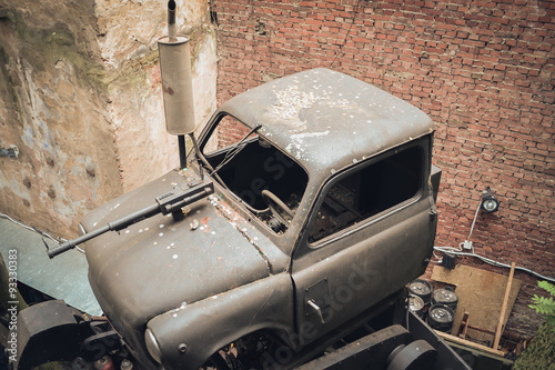 Old broken car with a machine gun in one of the courtyards Lviv photo