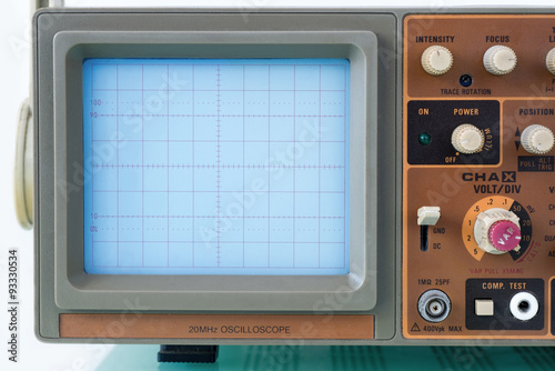 Closeup of CRT display monitor and control panel of an old oscilloscope photo