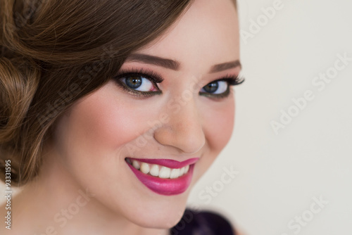 Girl with make-up and a flower smile