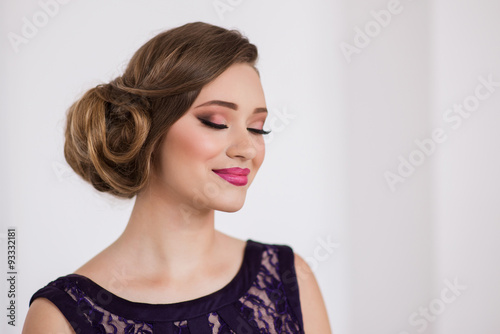 Girl with make-up and a flower smile