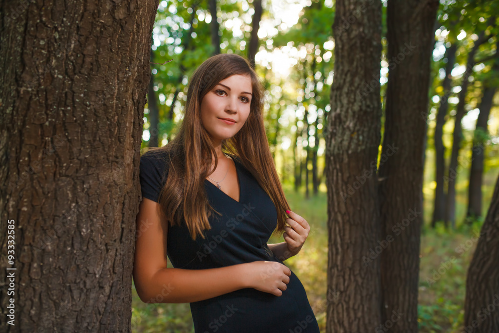 European appearance young woman brown hair in a black dress lean European appearance young woman brown hair in a black dress lean