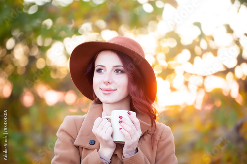 Woman with cup of tea or coffee