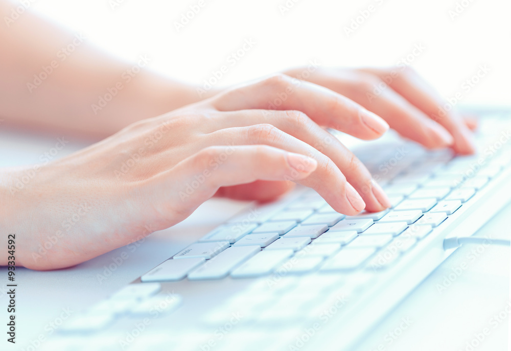 Female hands or woman office worker typing on the keyboard Female hands or woman office worker typing on the keyboard