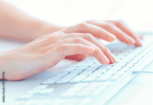 Female hands or woman office worker typing on the keyboard