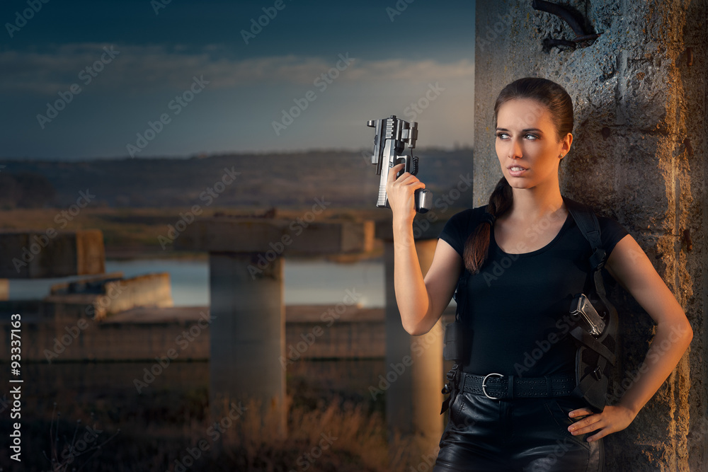 A young movie executive is holding a film reel and a gun Stock Photo - Alamy