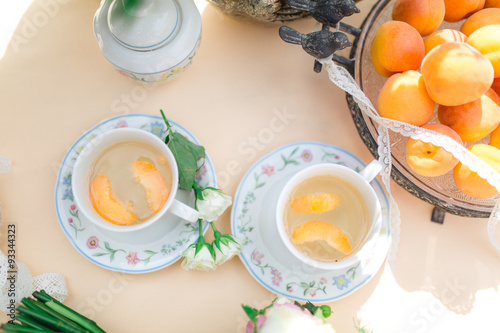 beautiful fresh cold peach tea with ripe peaches