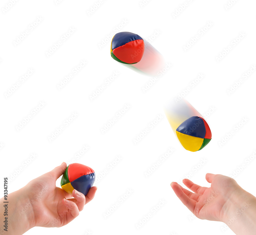 A person's two hands juggling three juggling balls in the air, isolated on  white. Photos | Adobe Stock