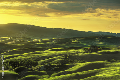 Tuscany spring, rolling hills on sunset. Rural landscape. Green photo