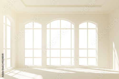 Sunny white loft interior with big windows