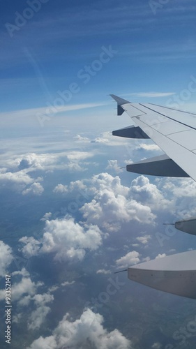 Fly by air over white cloud in a blue sky