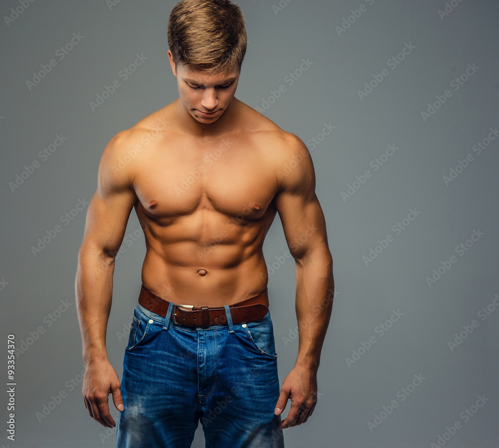 Young bodybuilder in denim jeans. Young bodybuilder in denim jeans.