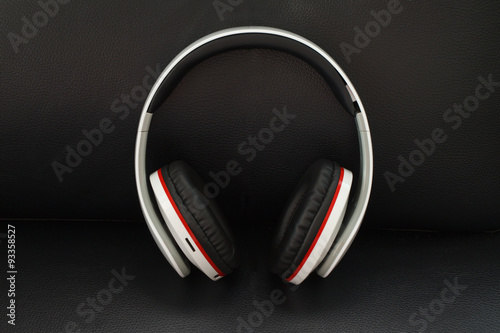 headphones on black leather background