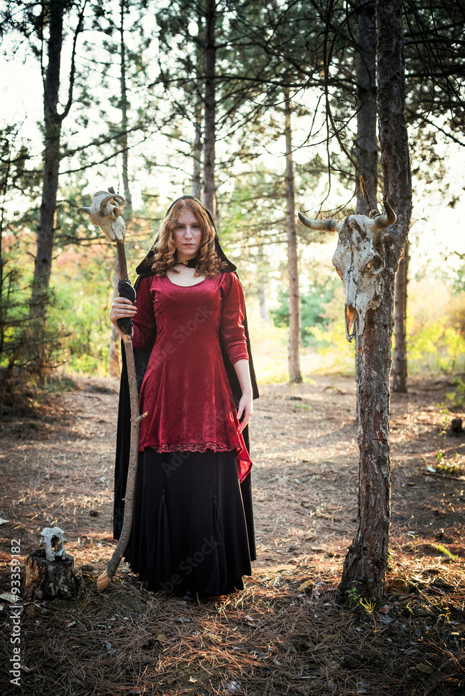 Witch in the wood. Practicing magic. Halloween concept Witch in the wood. Practicing magic. Halloween concept
