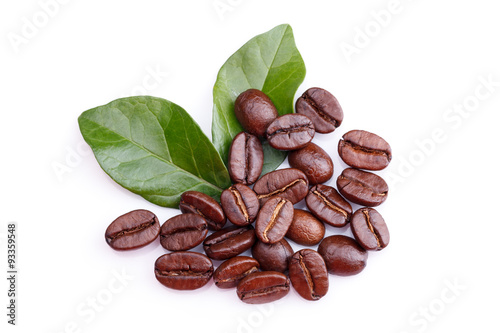 coffee grains and leaves on white background